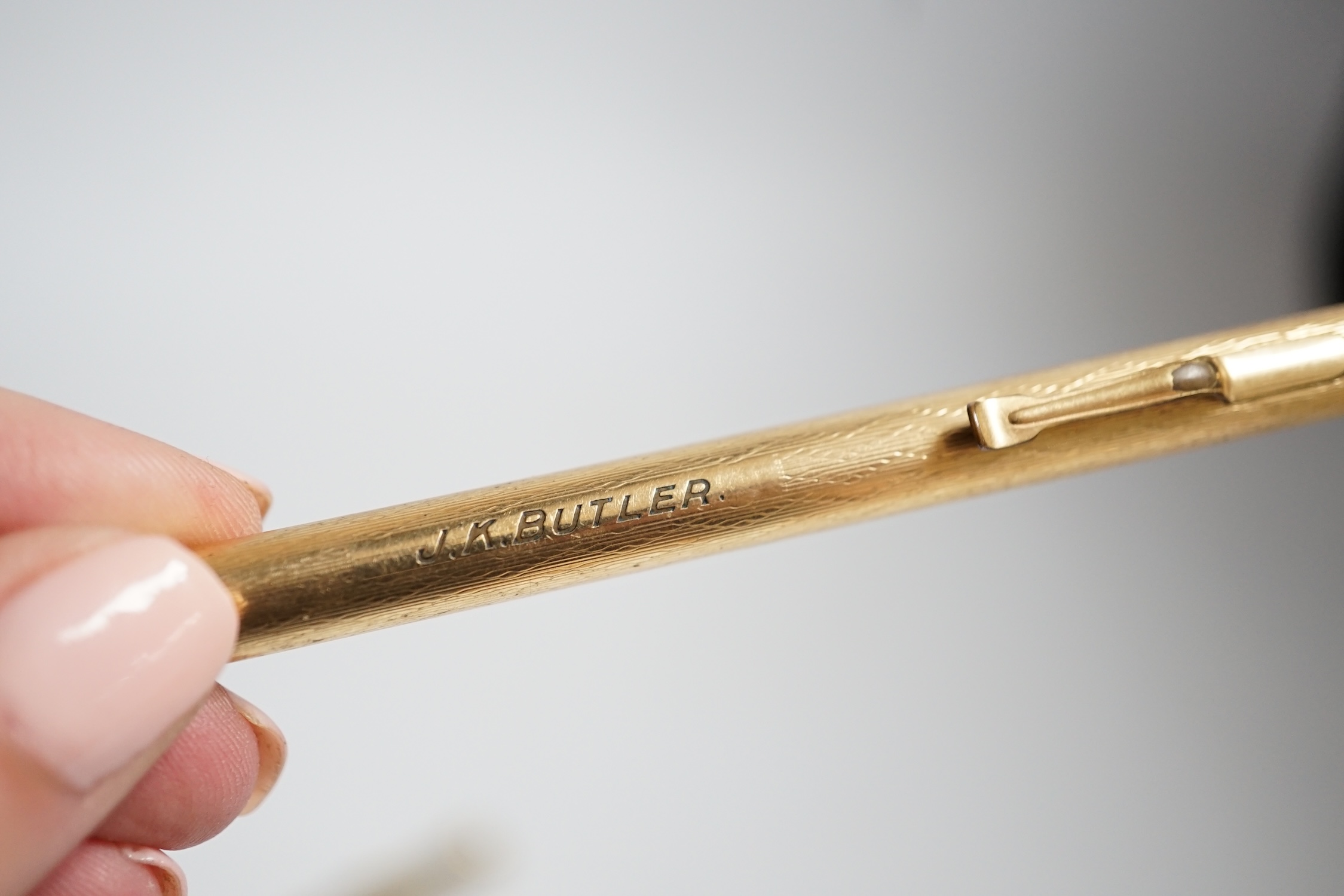 A 9 carat? (marks rubbed) pencil and another rolled gold pencil